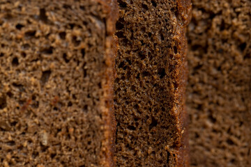 dark square loaf of bread on the table