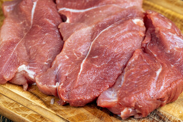 cooking pork meat on a cutting board