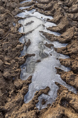 a deep track from a heavy car in a field