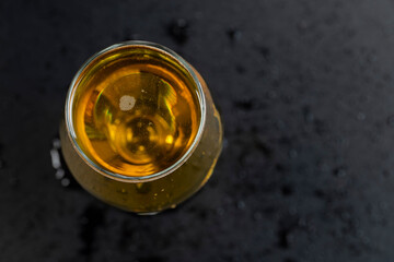 a glass glass with an alcoholic drink in close-up