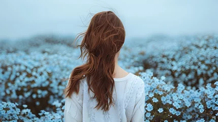 Fotobehang Woman in Field of Wild Blue Flowers Lo-fi Aesthetics © vanilnilnilla