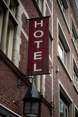 Closeup of Hotel sign on building facade in the street - 753753129