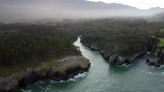 Aerial view coast with cliffs in Llanes, Asturias. Spain. Mouth of the Puron river.