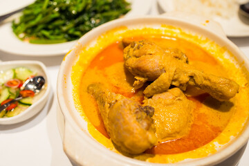 Bowl of chicken curry with potato
