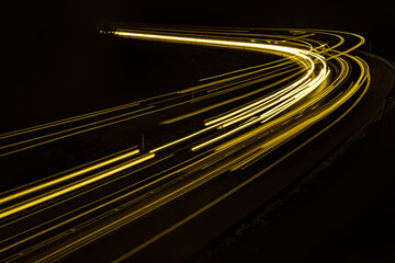yellow car lights at night. long exposure