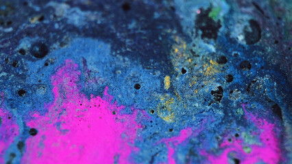 Shimmering liquid background. Sparkling fluid. Acrylic paint motion. Blue purple orange blend...