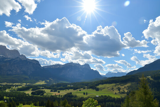 Picturesque mountain valley under a radiant sun in the clear blue sky