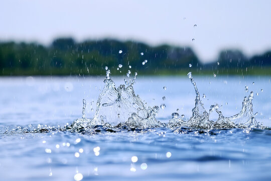 Splashing water droplets captured at high speed on a sunny day
