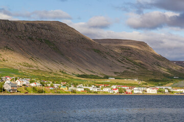 look over the small town Patreksfjörður in iceland at sunset in summer.