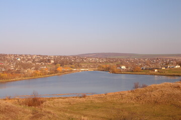 A body of water with a city in the distance