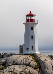 Fototapeta na wymiar Early morning at the lighthouse at Peggy's Cove in beautiful Nova Scotia, Canada