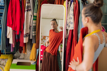 girl looking at herself in the mirror