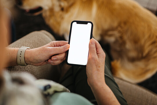 Mockup Mobile Phone with white screen in older woman's hands