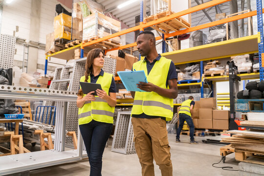 Two Workers Walking At Warehouse
