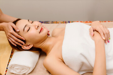 Relaxing with hand massage at beauty spa.