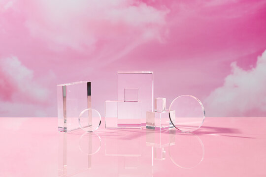 Front view of transparent podium with blank space in pink