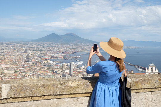 Woman taking photos of a City Of Naples From Castle Saint Elmo