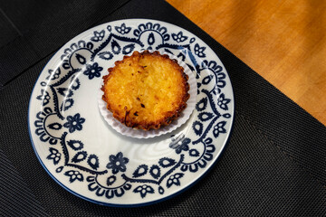 coconut pie on a plate decorated in blue