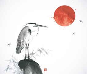 Ink wash painting with big red sun over a heron standing among reeds and dragonflies in flight. Traditional oriental ink painting sumi-e, u-sin, go-hua. Translation of hieroglyph - good luck