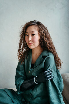 Portrait of curly-haired Asian Diverse woman.