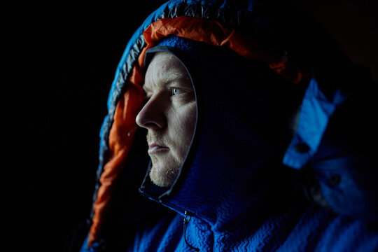 average mountain outdoor man in a dark cabin