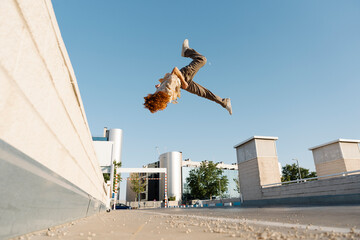 Parkour. Guy performs tricks in the city.