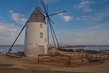 Fototapeta na wymiar windmill in the village by the sea