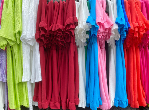 row of colourful dresses