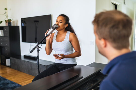Woman singing at home