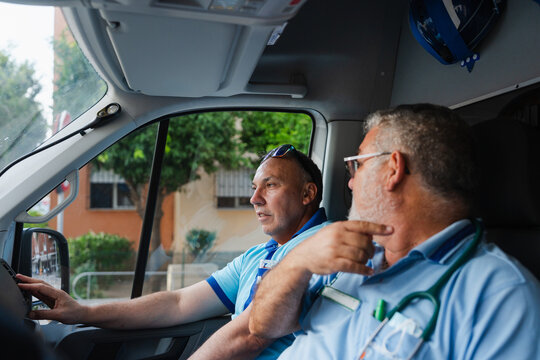 two paramedics working on an ambulance