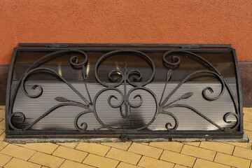 October 7, 2023 Russia, Zelenogradsk, carved forged cast iron grate
