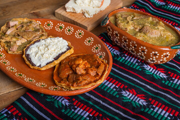 Sopes of chicharron in green sauce and red sauce. Mexican food.