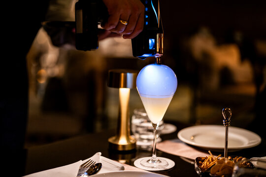 A vodka martini is made with a torch at a luxurious bar in Bangkok