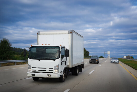Cab-over transportation vehicle truck on highway delivering cargo