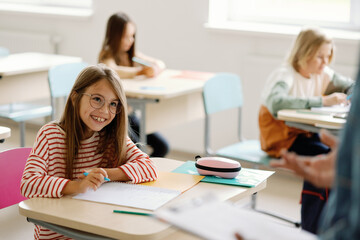Kid eye contact tutor smiling studying educational facility 