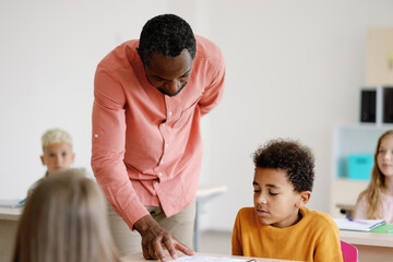 Tutor providing individual guidance to student