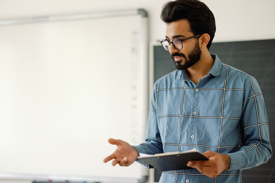 Multicultural teacher gesturing describing subject theme
