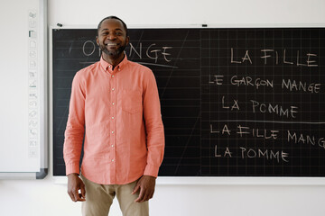 Profession language tutor smiling at camera