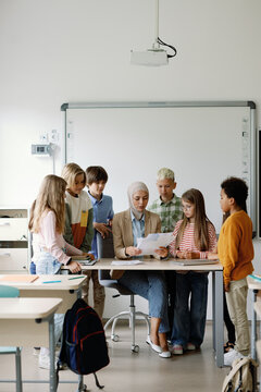 Art lesson teacher ponder student classmate feedback interact school