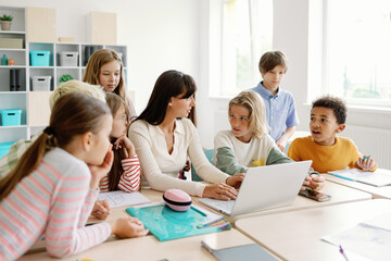 Teacher group active classmates studying primary school