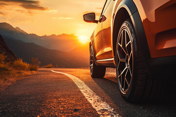 A close-up shot of the side of a car on a mountain road