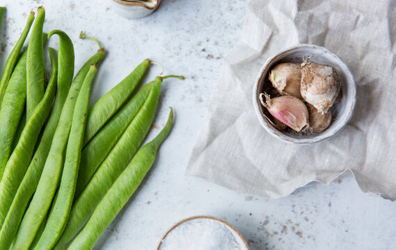 Freshly harvested runner beans and garlic