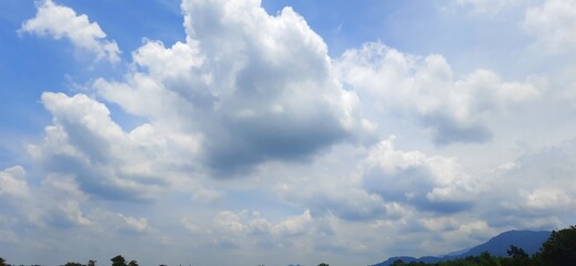 Blue sky with white clouds background. Sky daylight natural view