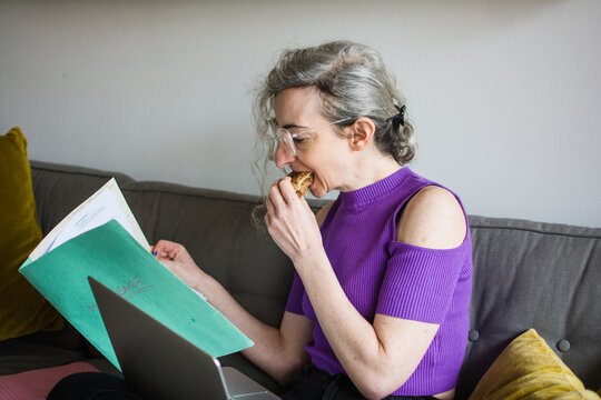 Woman reading mortgage papers