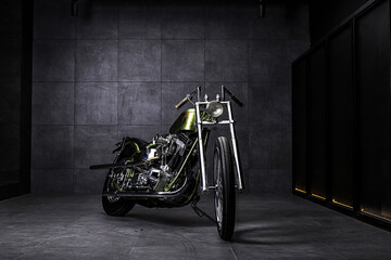 Chopper style motorcycle with green color hand painted full of chrome