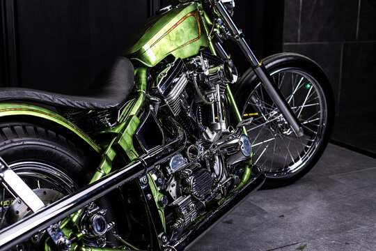 Chopper style motorcycle with green color hand painted full of chrome