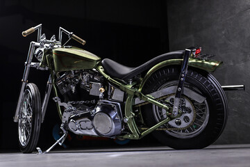 Fototapeta na wymiar Chopper style motorcycle with green color hand painted full of chrome