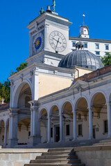 Beautiful white building  with arches, clock tower, Torre dell'Orologio, in Loggia di San Giovanni...