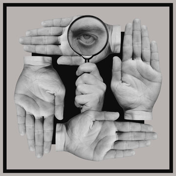 Hand holding magnifying glass with a eye inside and human palms