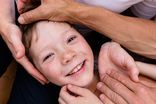 Kid's face among the arms
